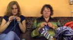 senior-grandma-young-granddaughter-talk-knit-grandmother-woman-colorful-balls-wool-thread-focus-change-shot-canon-xa-51050741